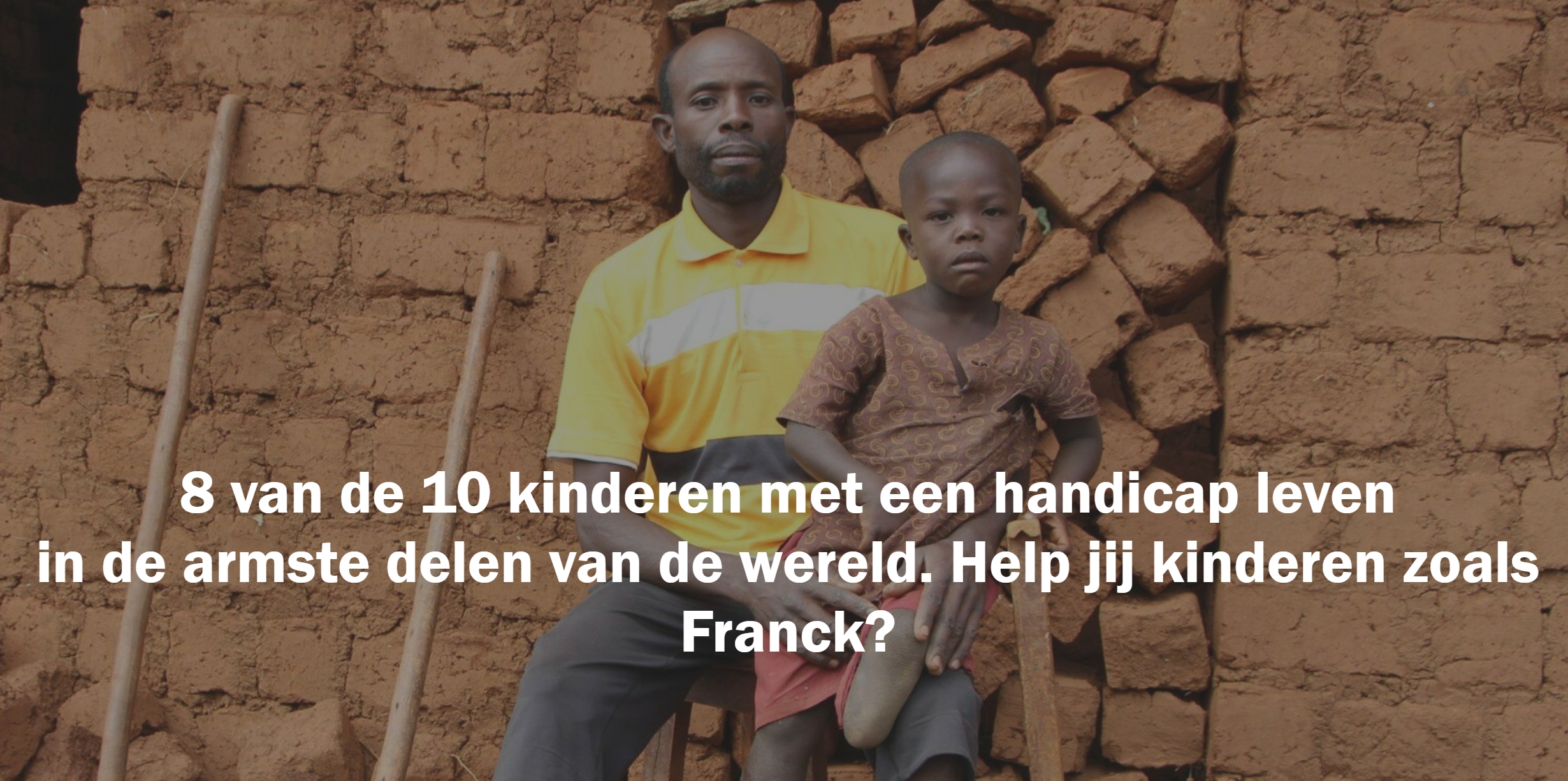 a photo of a man holding a child in a village